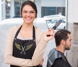 Hair Stylist wearing gold wings on apron from Trendy Salon Aprons